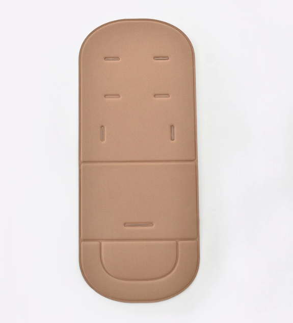 Minimalist tan universal baby stroller cushion with harness slots and stitched detailing on a white background.