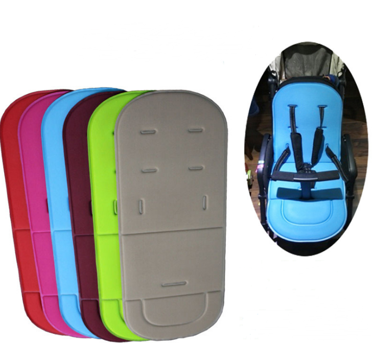 Universal cotton stroller seat pads in red, pink, blue, maroon, lime, and beige, shown installed in a stroller.