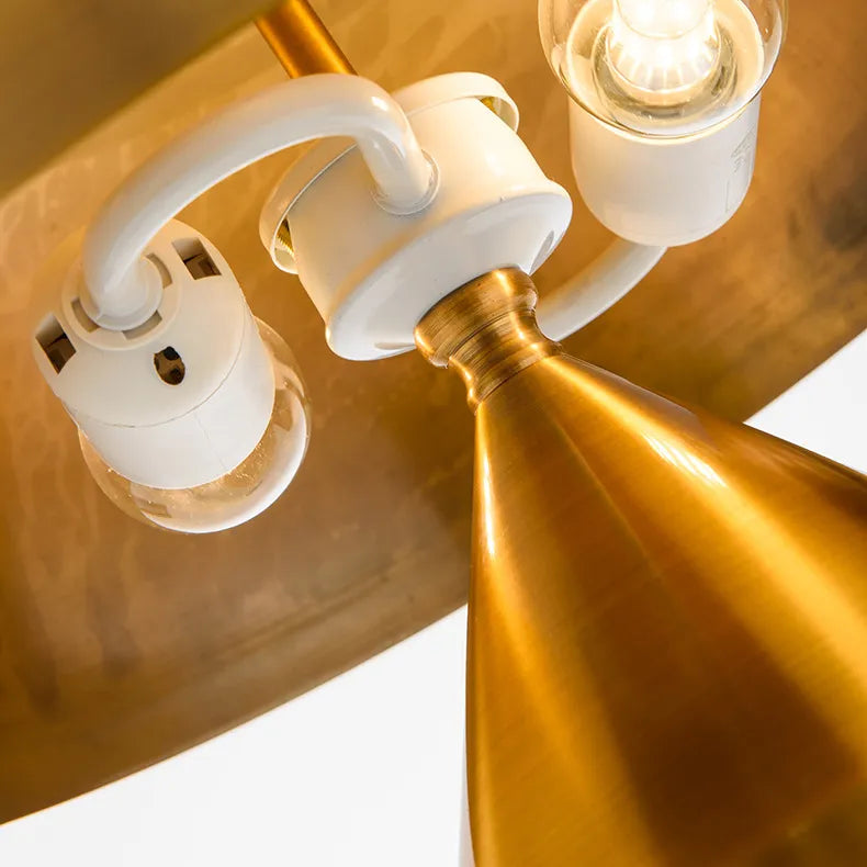 Chic copper mushroom desk lamp featuring a metallic dome shade, white hardware, and warm interior bulb lighting.