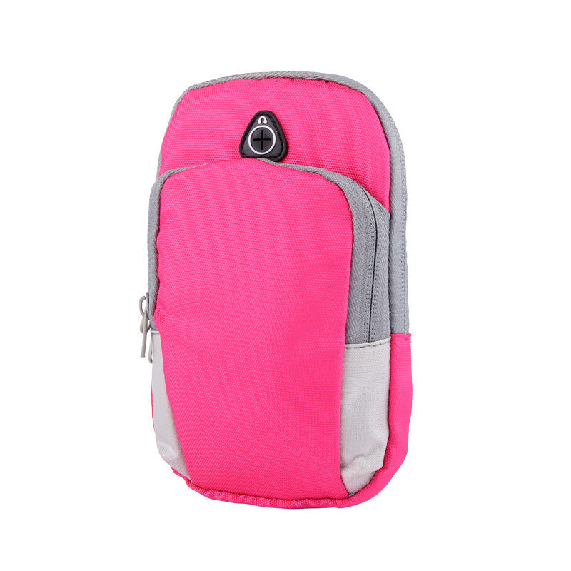 Hot pink outdoor arm pouch with grey accents, side zipper, and a black circular headphone cable port.