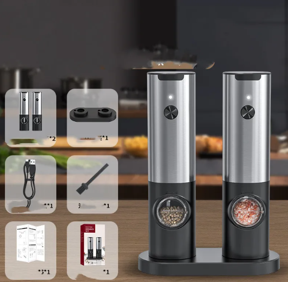 Two stainless steel and black electric pepper grinders on a base, with accessories including a charging cable and brush.