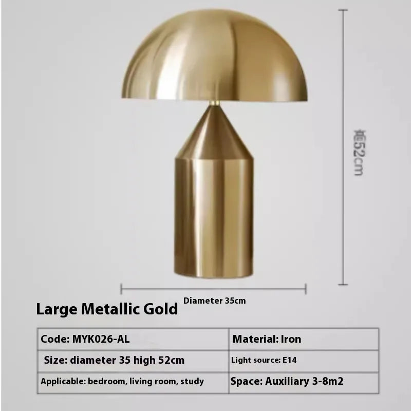 Chic metallic gold mushroom-shaped desk lamp with a rounded shade and cylindrical base, 52cm high, 35cm diameter.
