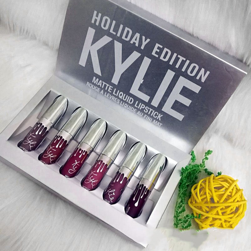 Silver box set of six Kylie Holiday Edition matte liquid lipsticks in deep red and berry shades.