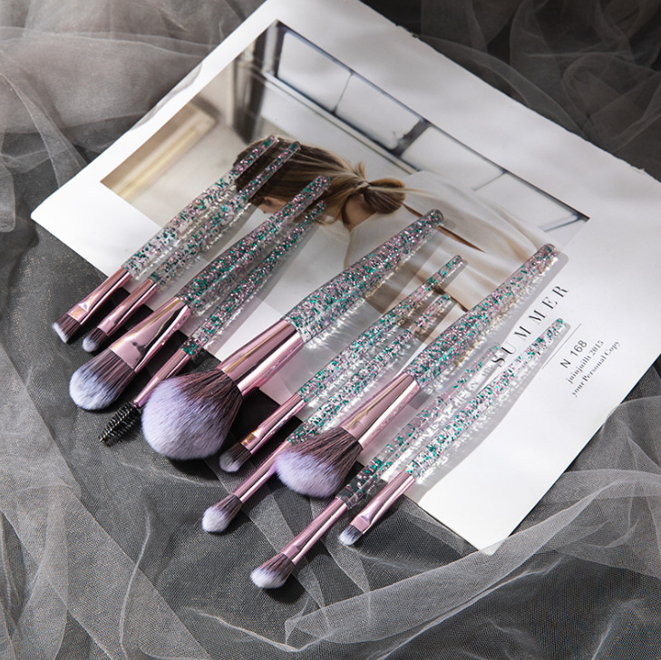 Beauty Master 10-piece brush set with glitter-filled transparent handles, rose gold ferrules, and soft purple bristles.