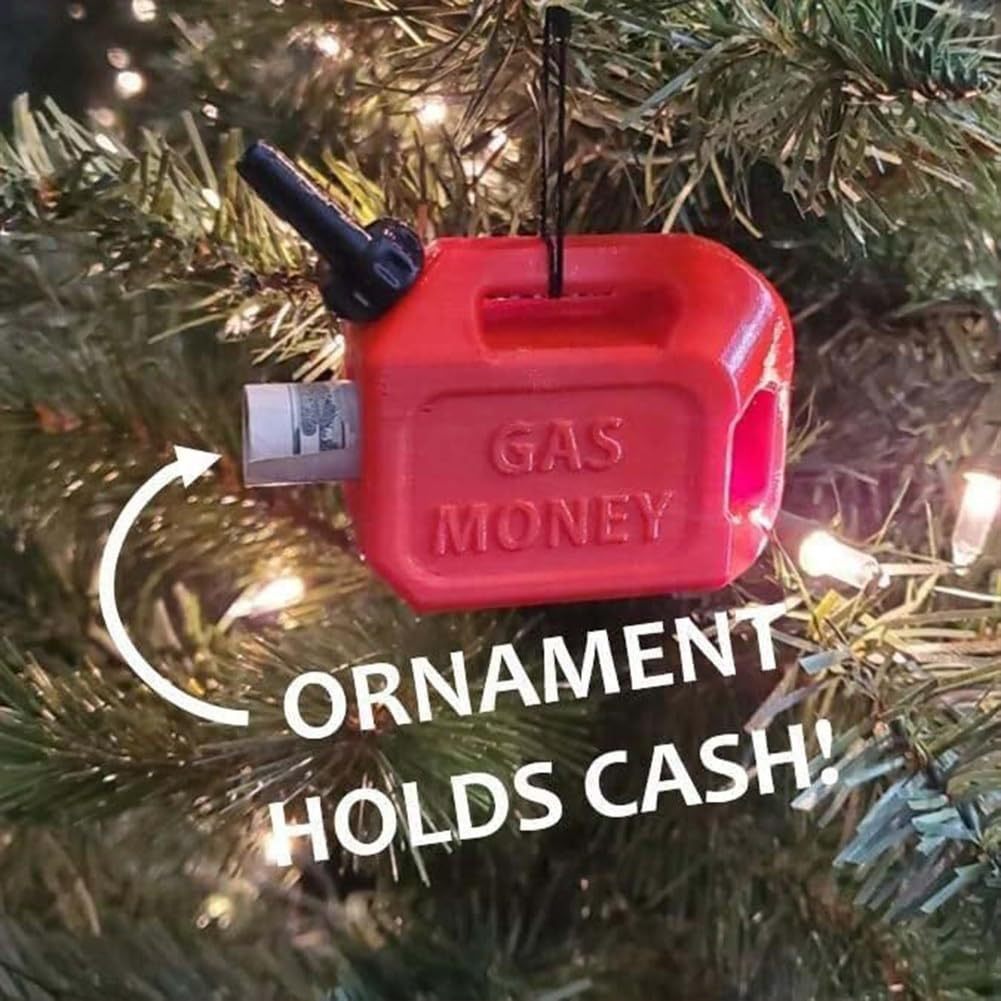 Red plastic gas can Christmas ornament labeled "GAS MONEY" hanging on a tree with a rolled-up bill tucked inside.